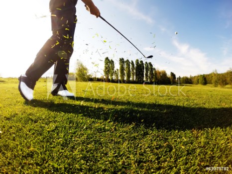 Picture of Golfer performs a golf shot from the fairway